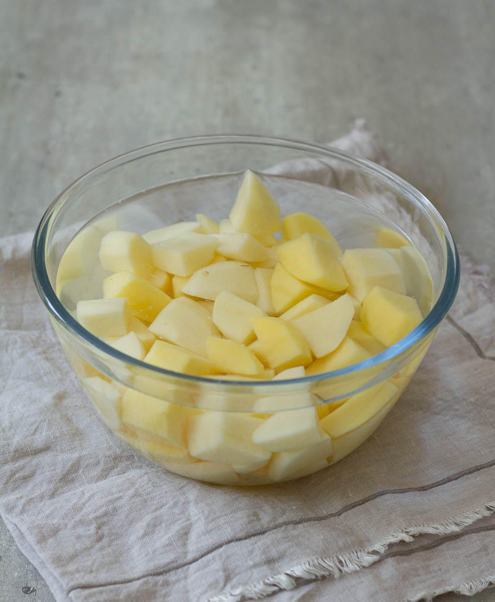 Soak the cubed potatoes in water