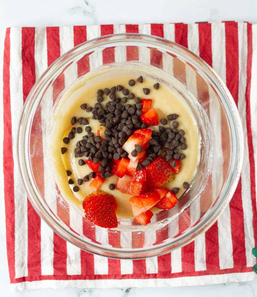 chopped strawberries and chocolate chips in the batter